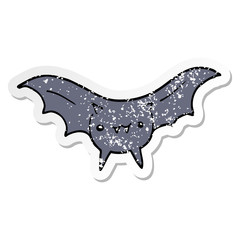 distressed sticker of a cartoon bat
