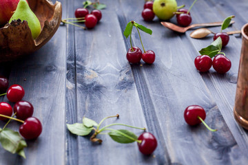 Set of fresh fruits and berries on wooden background