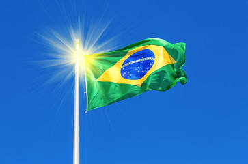 Flag of Brazil flying in the wind against the sky