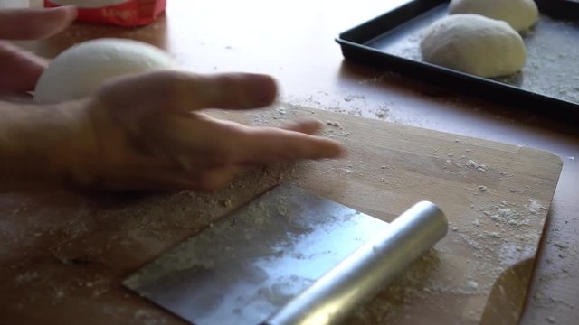 Chef preparing dough for pizza, croissants or bread