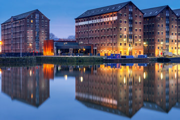 Gloucester docks warehouses reflected in quay on Sharpness Canal