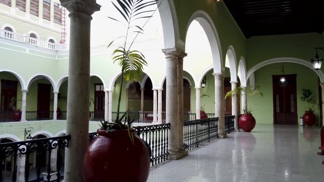 Walking around the interior courtyard of the Governor of Yucatan’s historic Palace in Merida, Mexico.