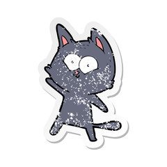 distressed sticker of a cartoon cat waving