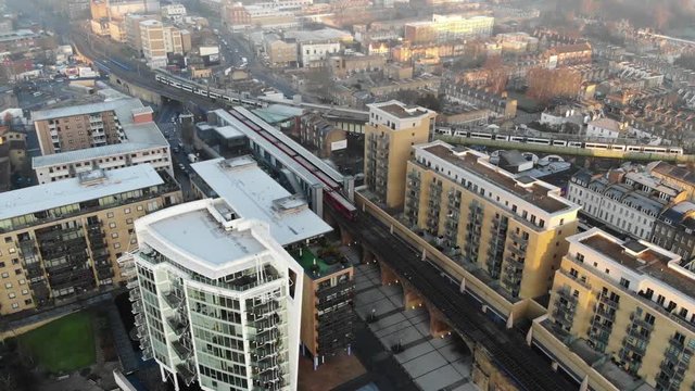 An aerial view of Limehouse train station and two trains running down the tracks