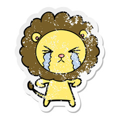 distressed sticker of a cartoon crying lion