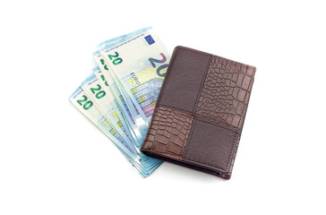 A new purse with money on a white background.