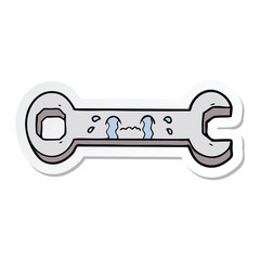 sticker of a cartoon crying spanner