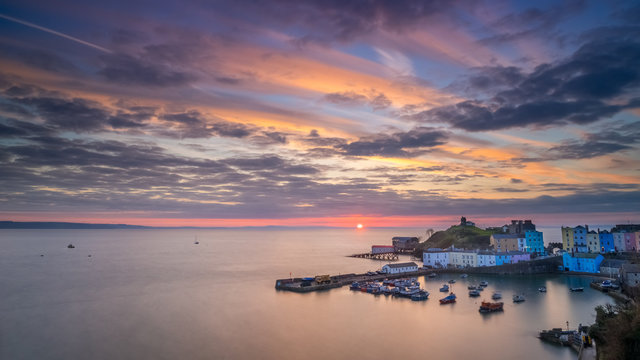 Tenby Harbour at sunrise with spectacular sky