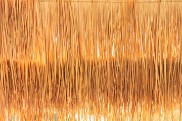 Closeup golden grasses thatch roof for wallpaper.