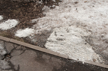 Deicing chemicals near asphalt road