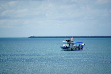 fishing boat in the sea with blue sky