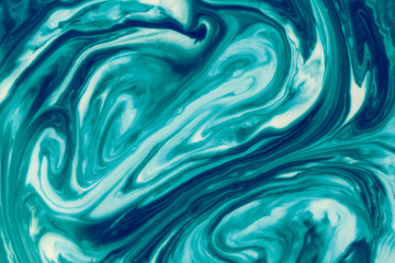 Cyan liquid ink swirl abstract background