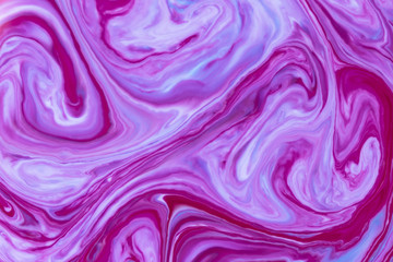 Purple liquid ink swirl abstract background