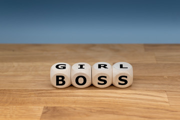 Dice form the expression "GIRL BOSS"