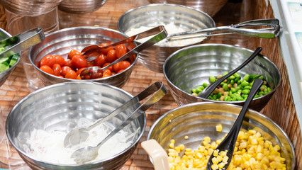 Vegetables in bowls at buffet