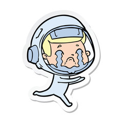 sticker of a cartoon crying astronaut