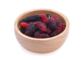 mulberry in wooden bowl isolated on white background