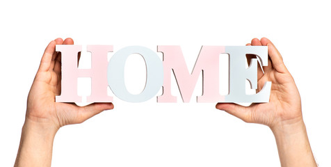 Close up view of Worker Man Hands with HOME word concept. Male Hands with Text Banner. Human Hands holding Home word, isolated on white background.