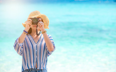 Summer time woman vacation on the beach. Relax time in summer lifestyle outdoor shot on tropical...