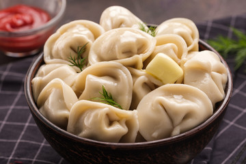 Homemade meat dumplings - russian pelmeni. Dumplings, filled with meat, ravioli. Dumplings with filling