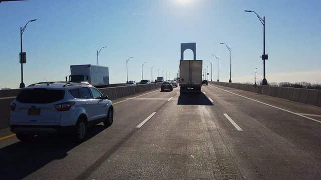 POV Driving Forward Over a Bridge in Daylight