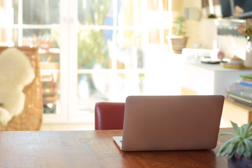 Unfolded laptop on a table for home office, homework, study or surfing the web