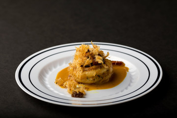 Appetizers on plates with black background