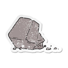 distressed sticker of a cartoon large rock