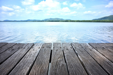 Fototapeta na wymiar Wood floor with sea and mangrove forest