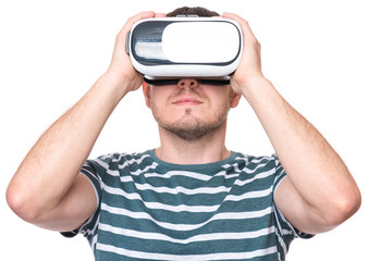 Man wearing virtual reality goggles watching movies or playing video games - closeup. Male looking in VR glasses, isolated on white background.