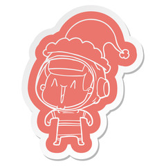 cartoon  sticker of a astronaut man wearing santa hat