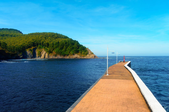 Pier in Armintza on sunny day