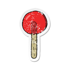 retro distressed sticker of a cartoon lollipop