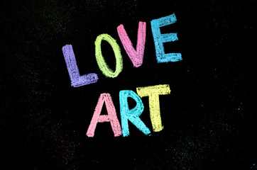 colored text love art on blackboard