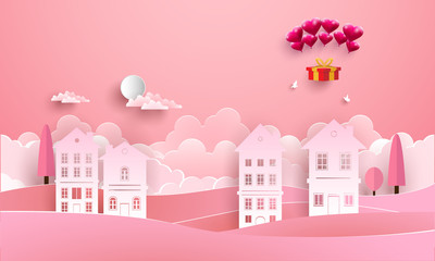 love with hot air balloon flying over the houses. paper art style
