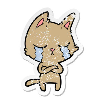 distressed sticker of a crying cartoon cat with folded arms