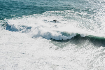 Fototapeta premium Wave and foam in the sea or ocean close-up. Beautiful nature.