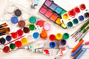 Paint brushes and paints for drawing.