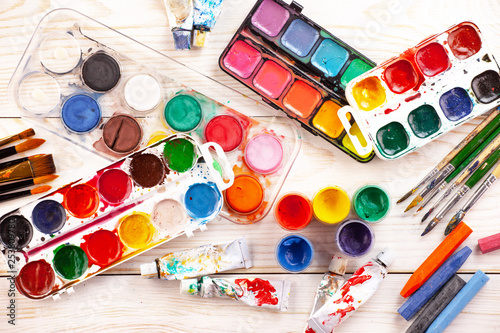 Paint brushes and paints for drawing.