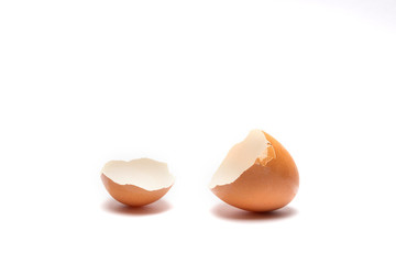 A cracked  brown discoloration egg shell on white background isolated