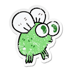 distressed sticker of a quirky hand drawn cartoon fly
