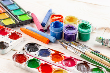 Paint brushes and paints for drawing.