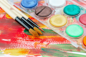 Obraz premium Paint brushes and paints for drawing.