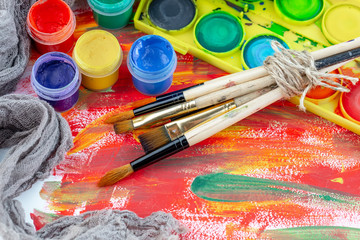Paint brushes and paints for drawing.