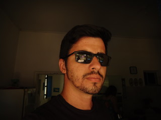 young man of arabian descent wearing sunglasses