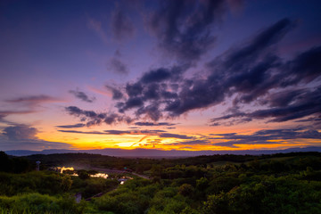  Landscape of beautiful sky while sunset or sun rise over the mountain with small lake and grass field in foreground
