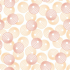 Red and orange concentric circles with dotted outline. Seamless geometric pattern on white background. Vector image