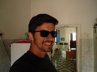 young man of arabian descent wearing sunglasses