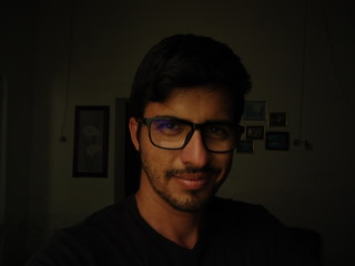 Young man of Arab descent wearing glasses
