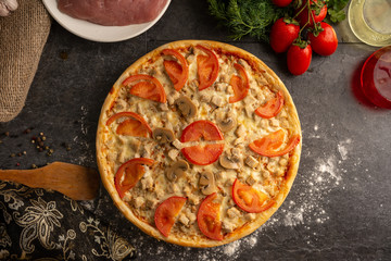Meat pizza with pork and mushrooms